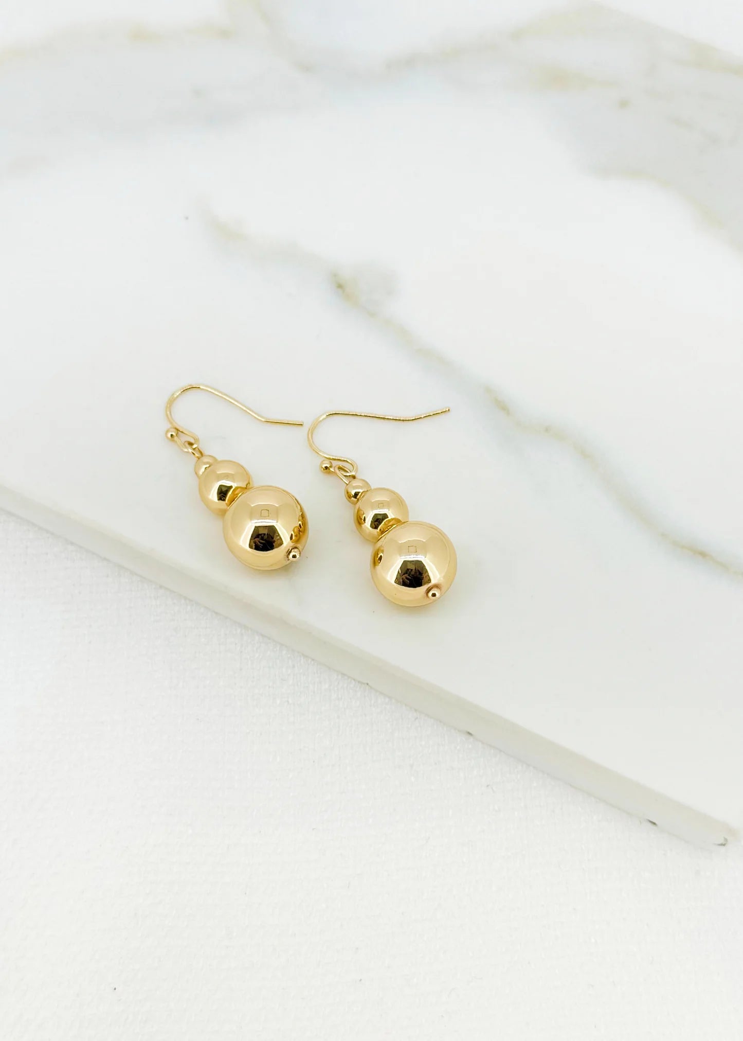 Envy Ball Dropper Earrings In gold