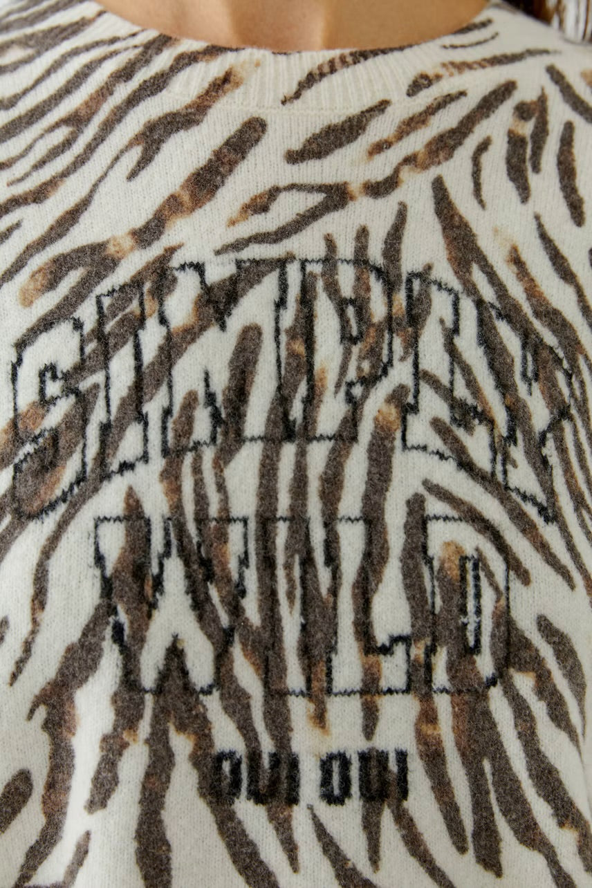 Zebra patterned pullover in white,brown & black