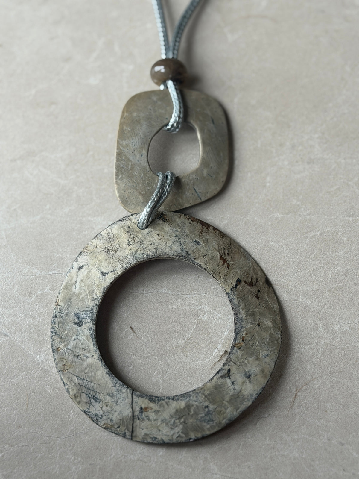 Double disk cord necklace in grey multi