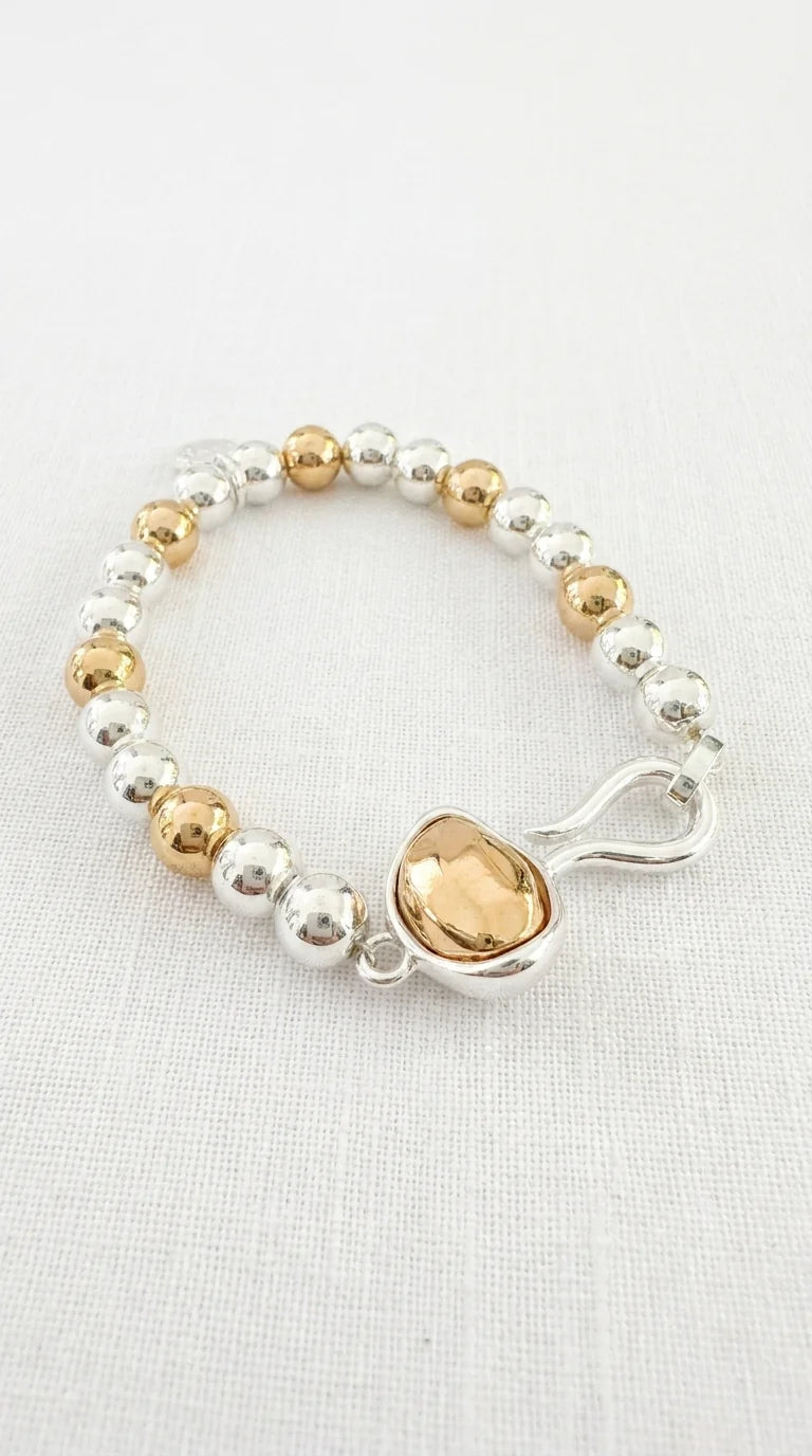 Two tone beaded elasticated bracelet with silver hook design