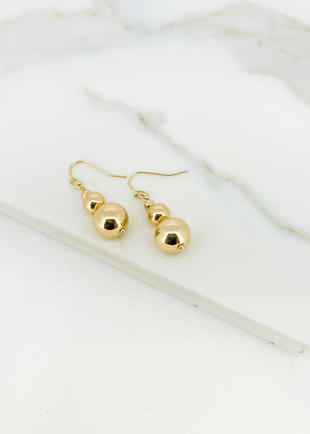 Envy Ball Dropper Earrings In gold