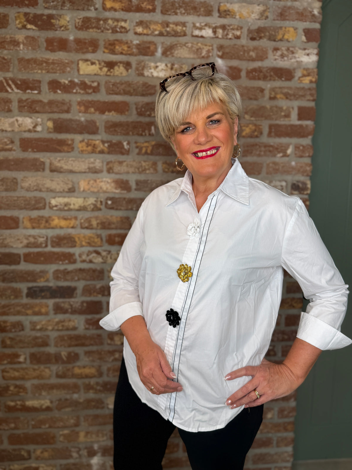 Shirt with floral details in white