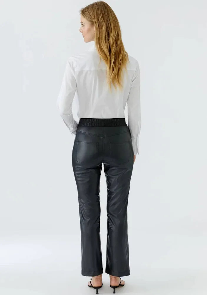 Leather look pull on trousers in black