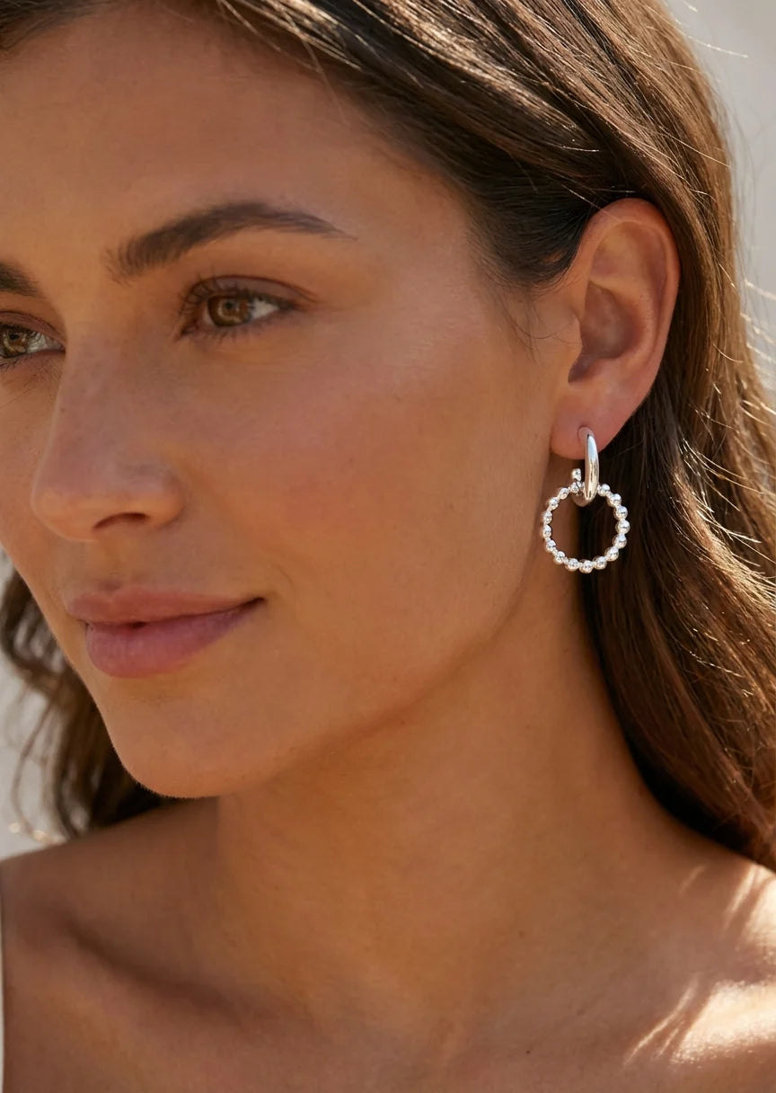 Silver earring with beaded hoop