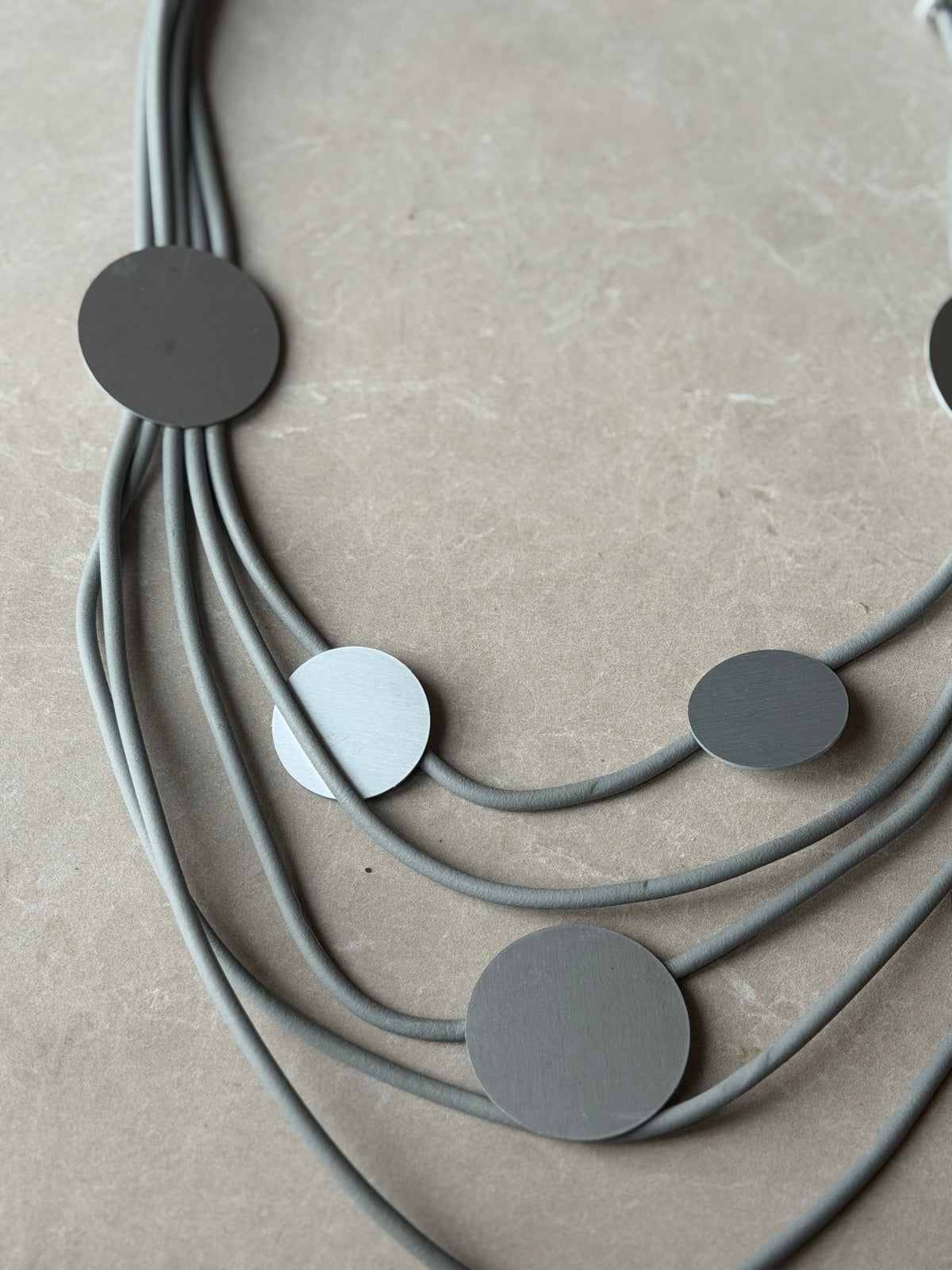 Tiered rubber & disk necklace in grey