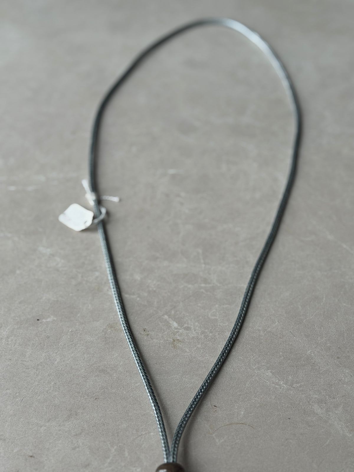 Double disk cord necklace in grey multi