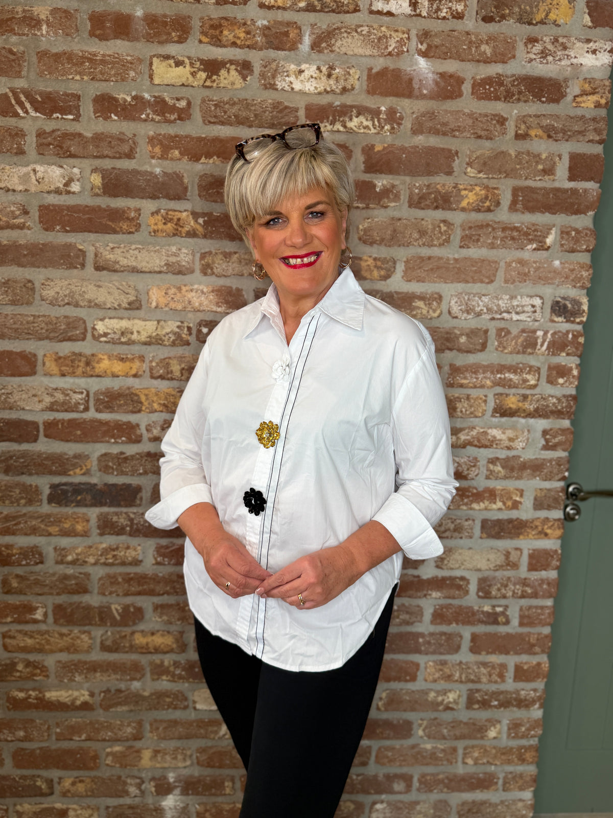 Shirt with floral details in white