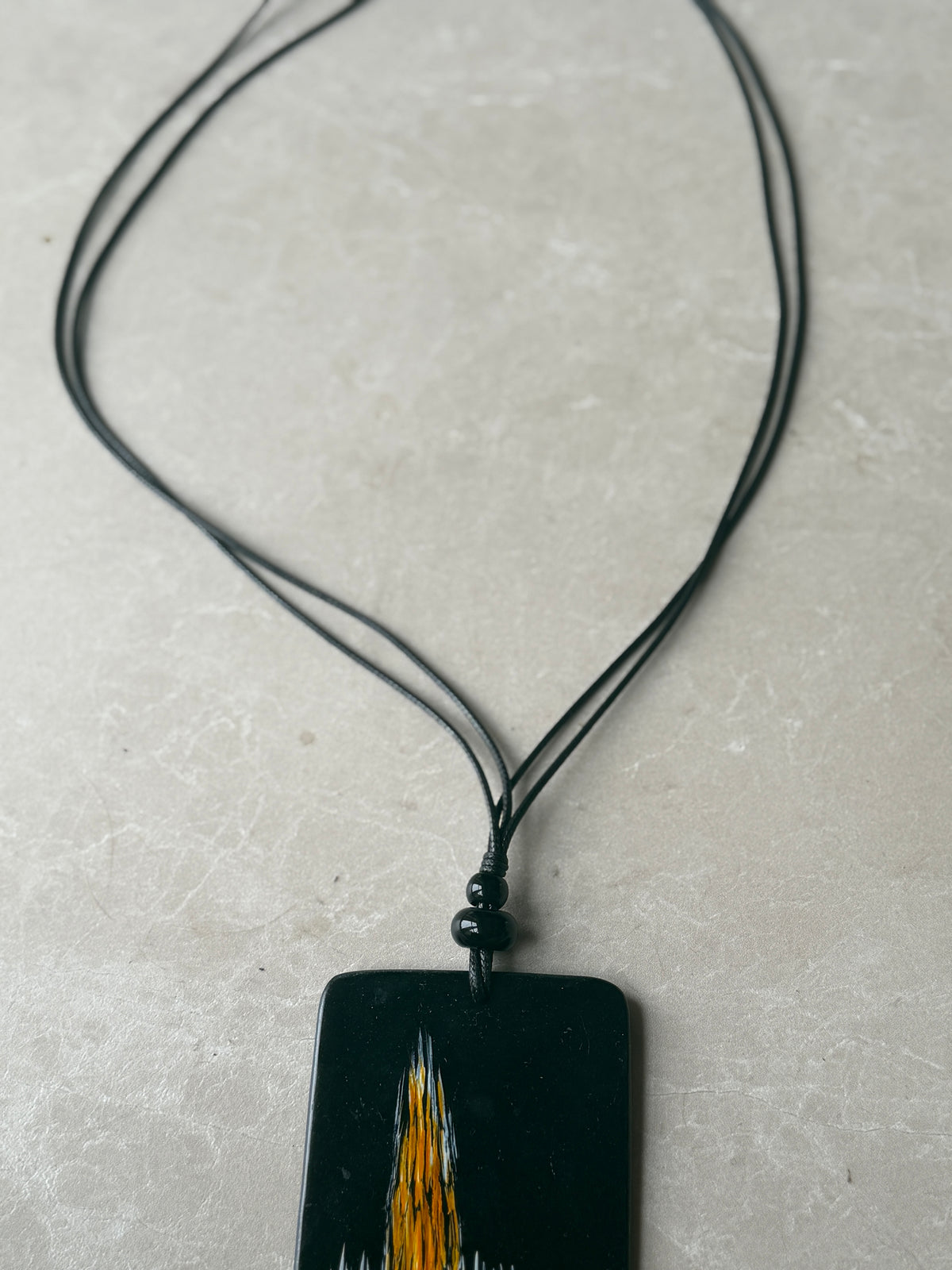 Disk necklace in black & orange