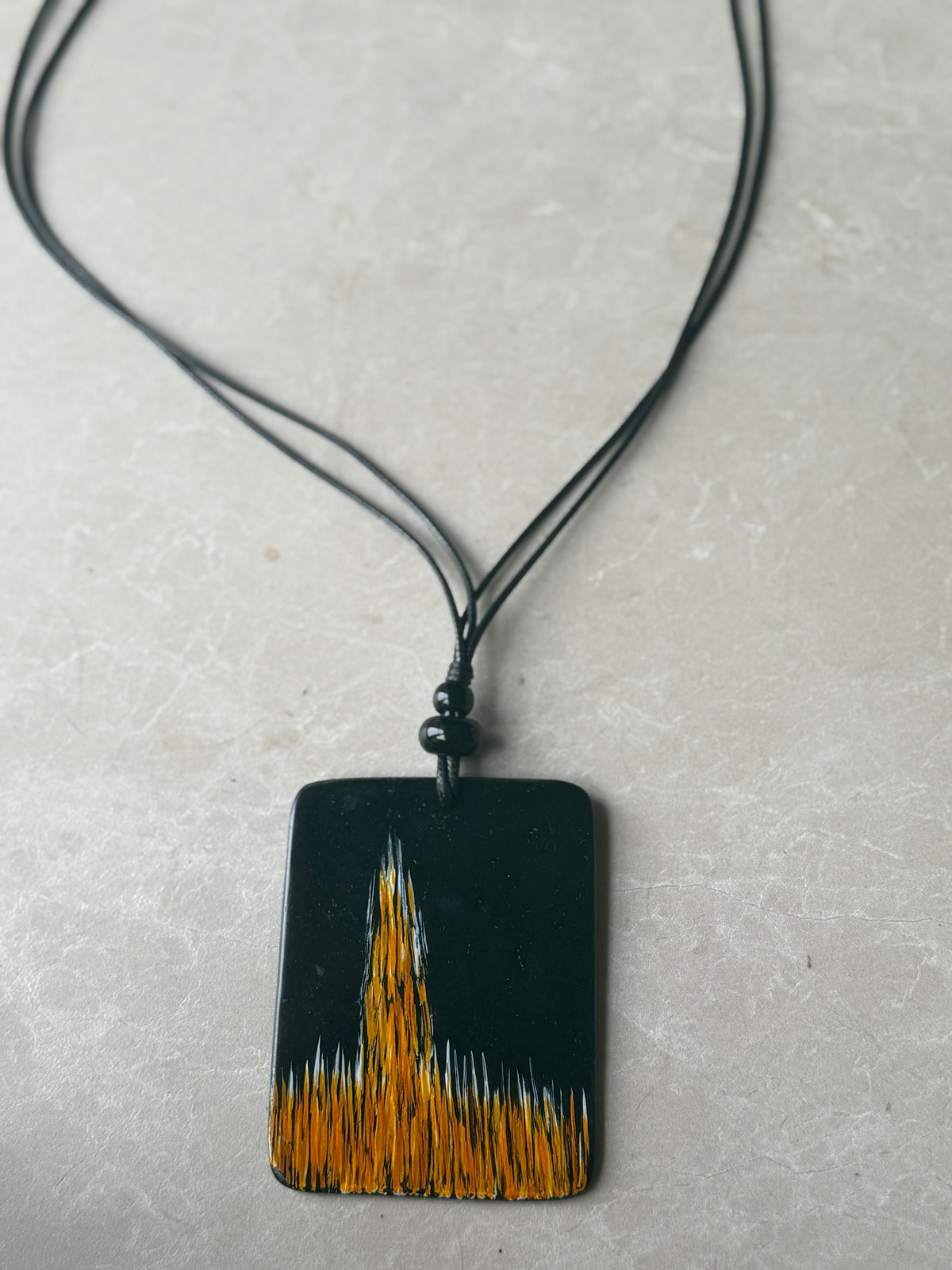 Disk necklace in black & orange