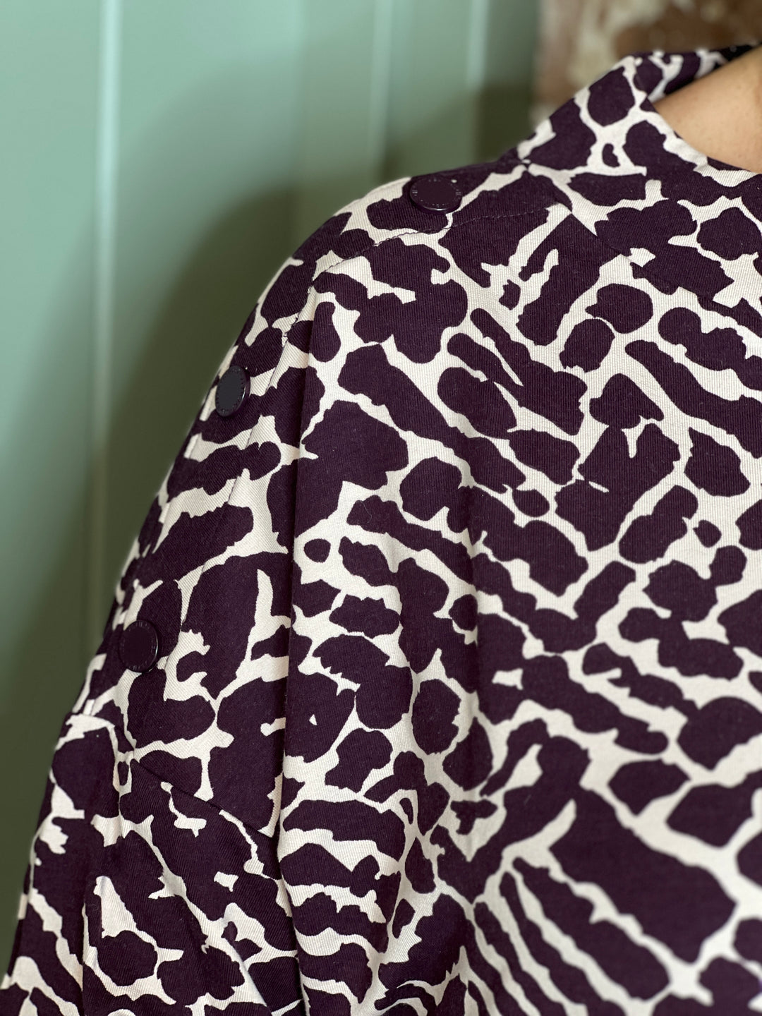 Cecil Buttoned Funnel Top In Eggplant Red