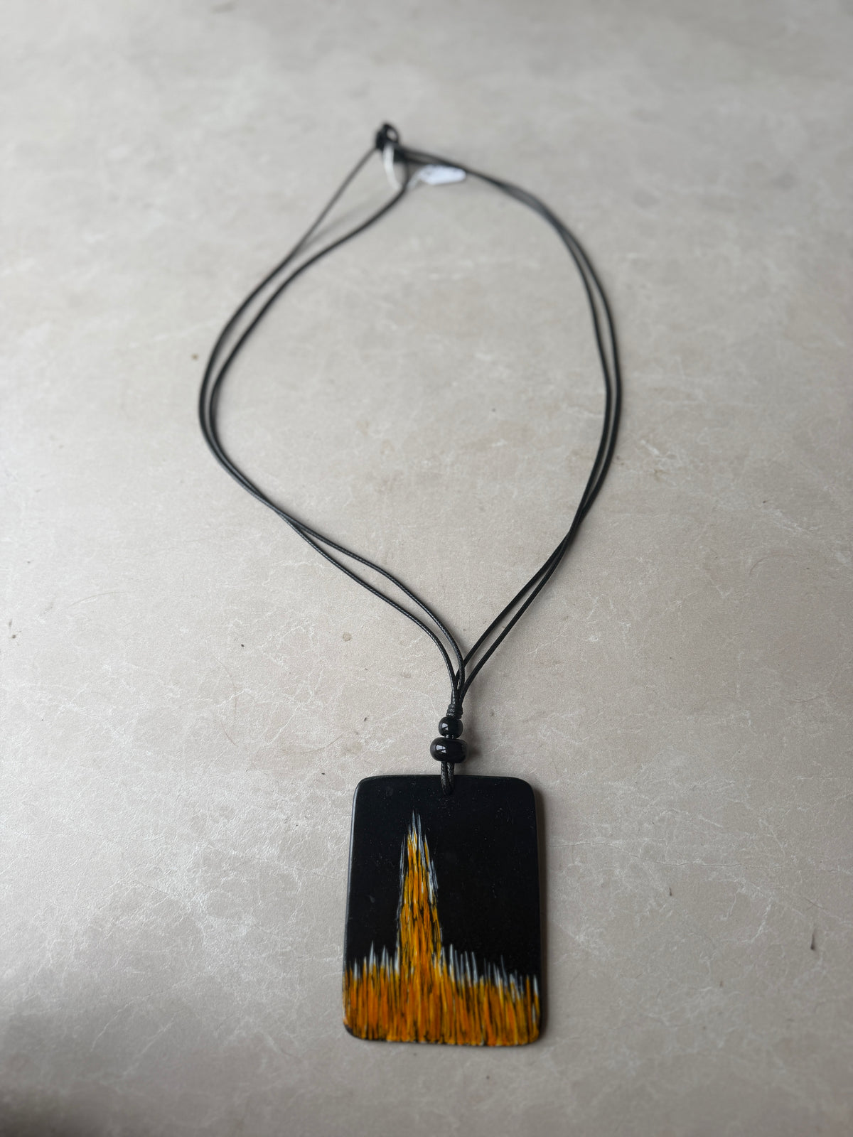 Disk necklace in black & orange
