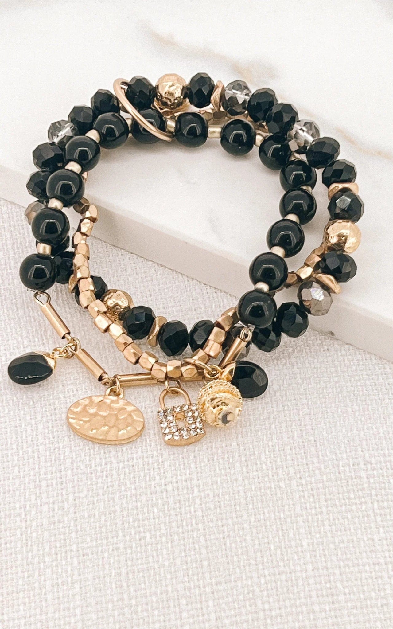 Envy triple layer charm Bracelet in gold & black